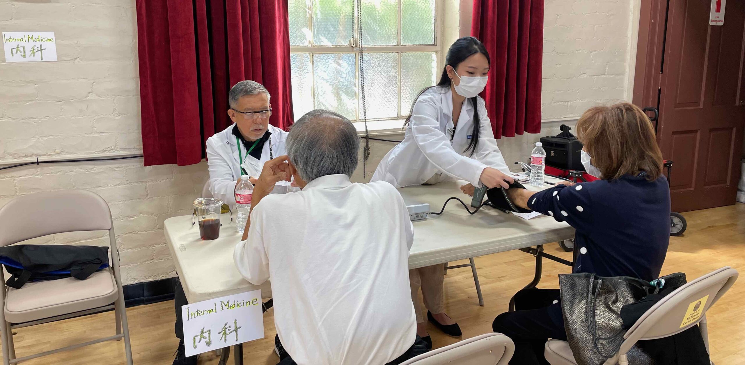 Dr. Matsumoto and resident Dr. Matsuno serving Nikkei patients at the health fair