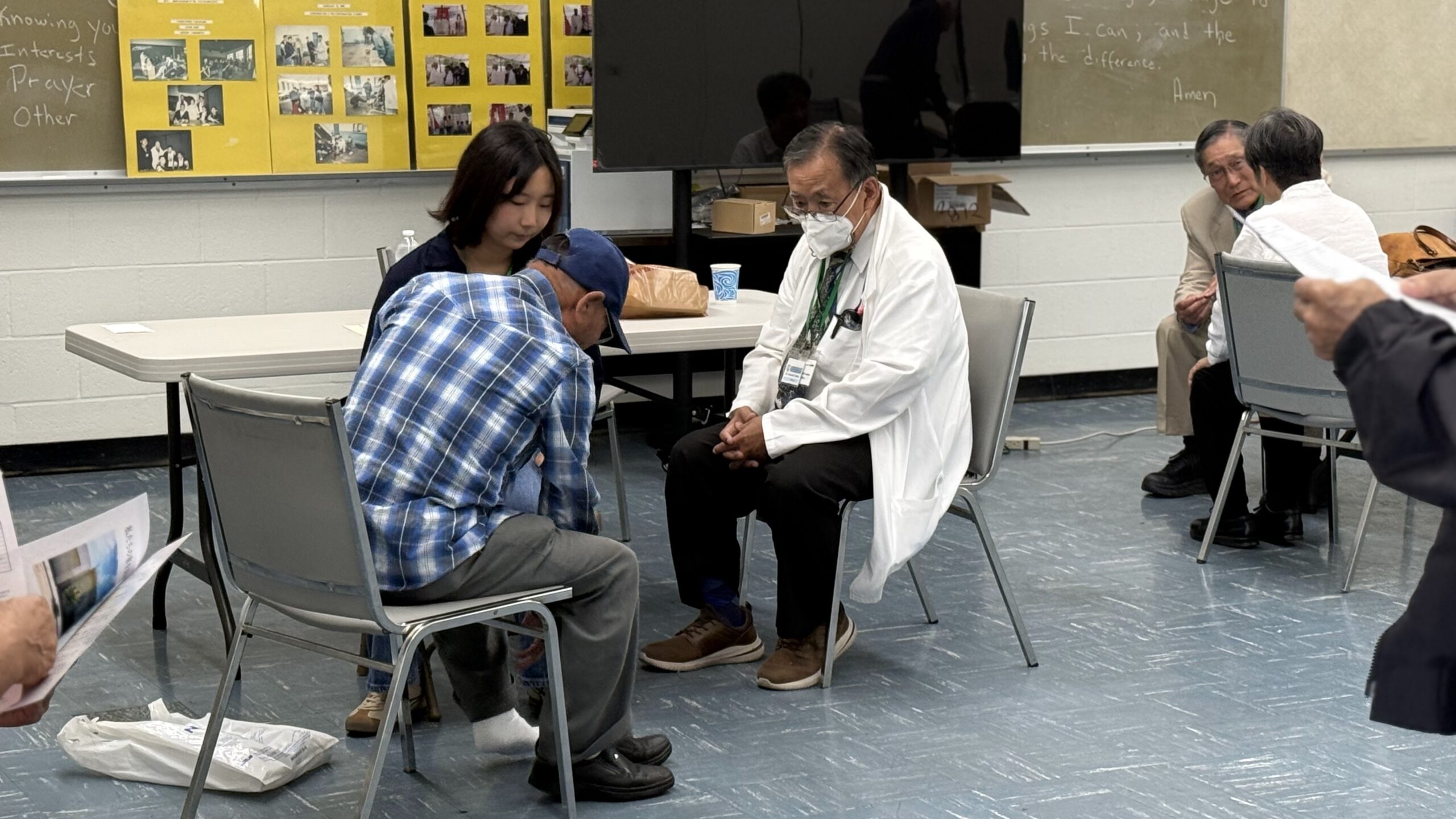 Dr. Teshima from Podiatry with Japanese translator on left, and Dr. Itagaki from Orthopedics on the right.
