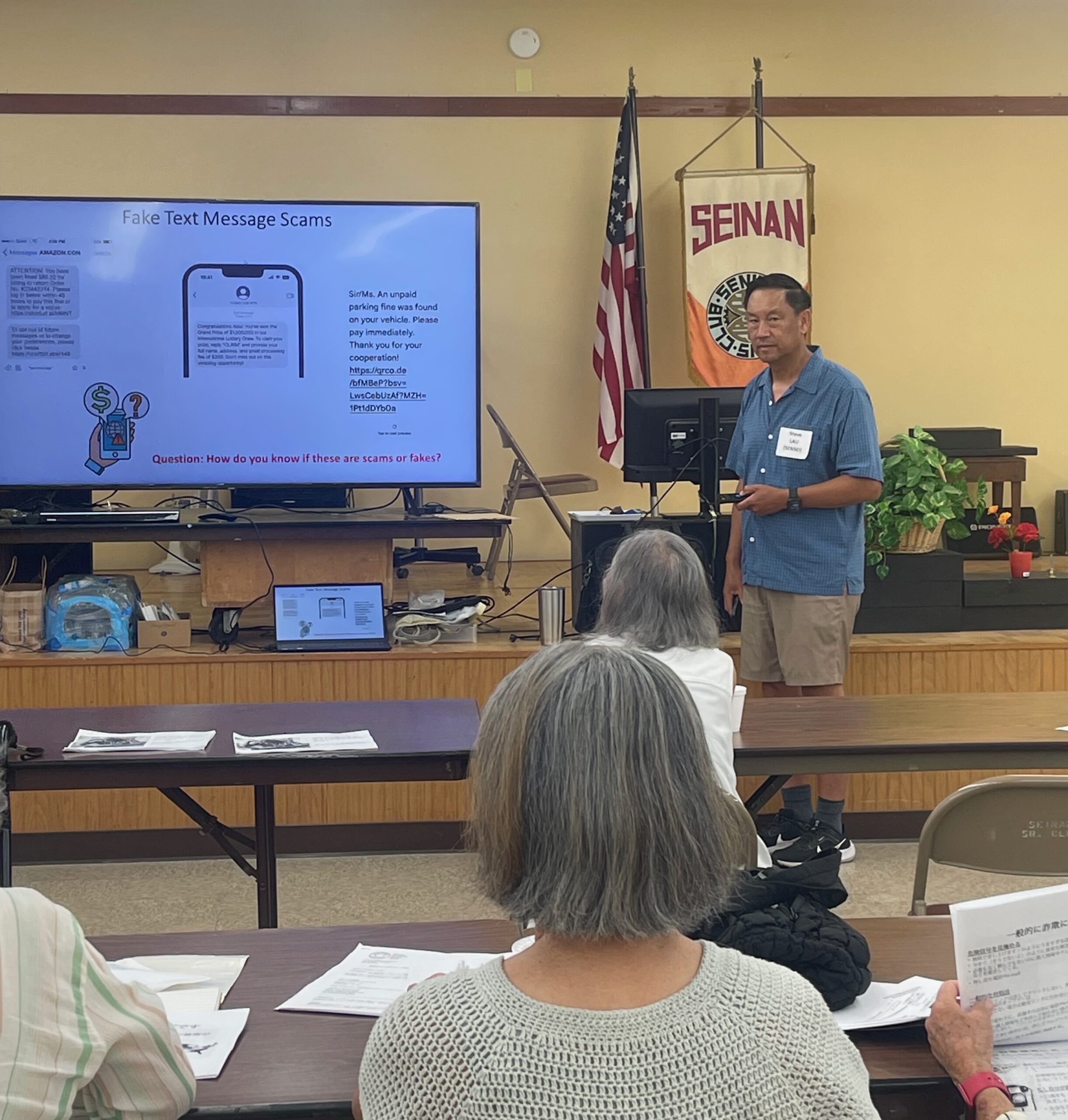 Steve Lau giving a presentation with Japanese translation by Naoko Okada, about detecting & avoiding internet & phone scams for seniors